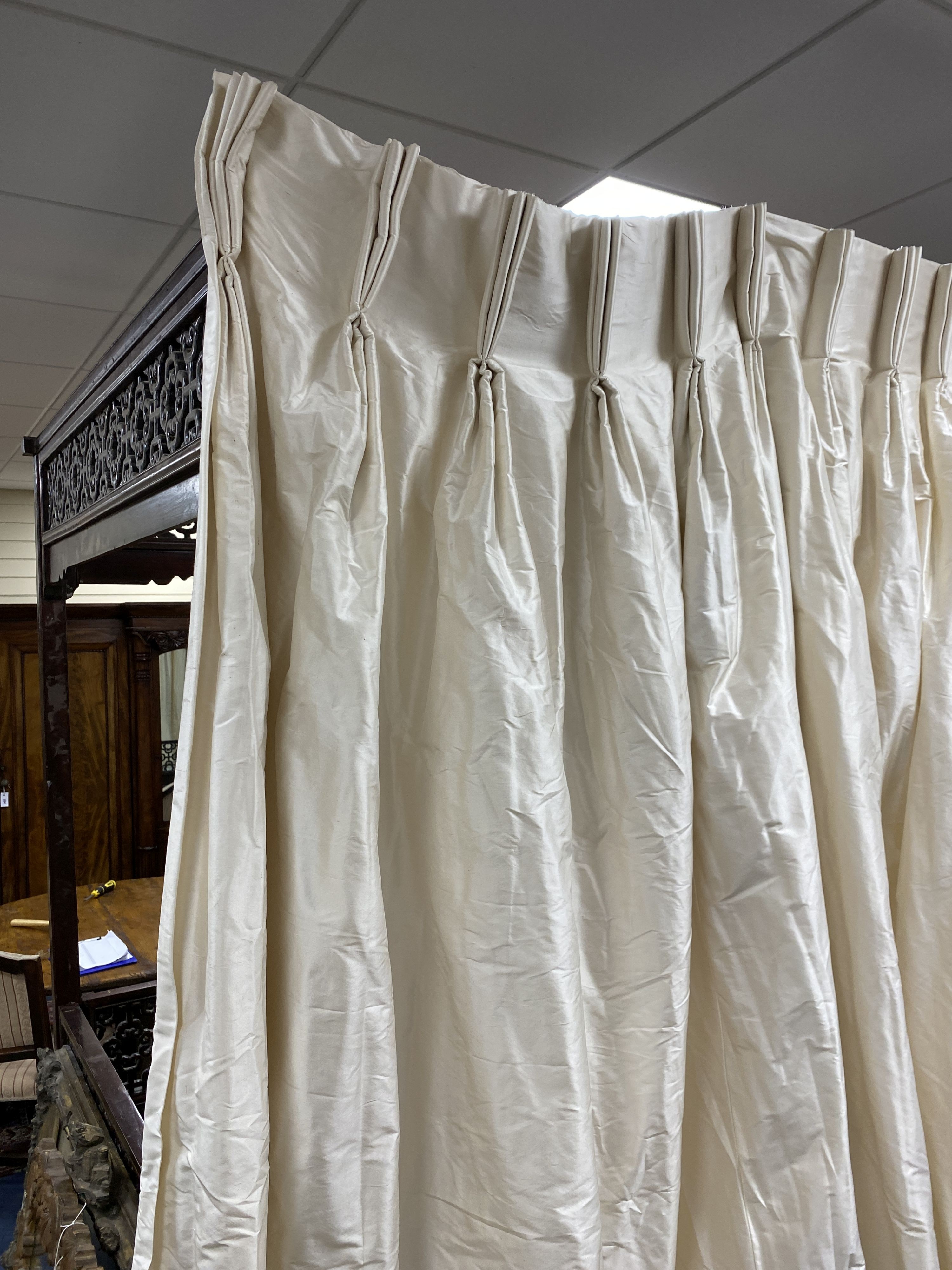 A large pair of cream silk curtains. 100 inches drop